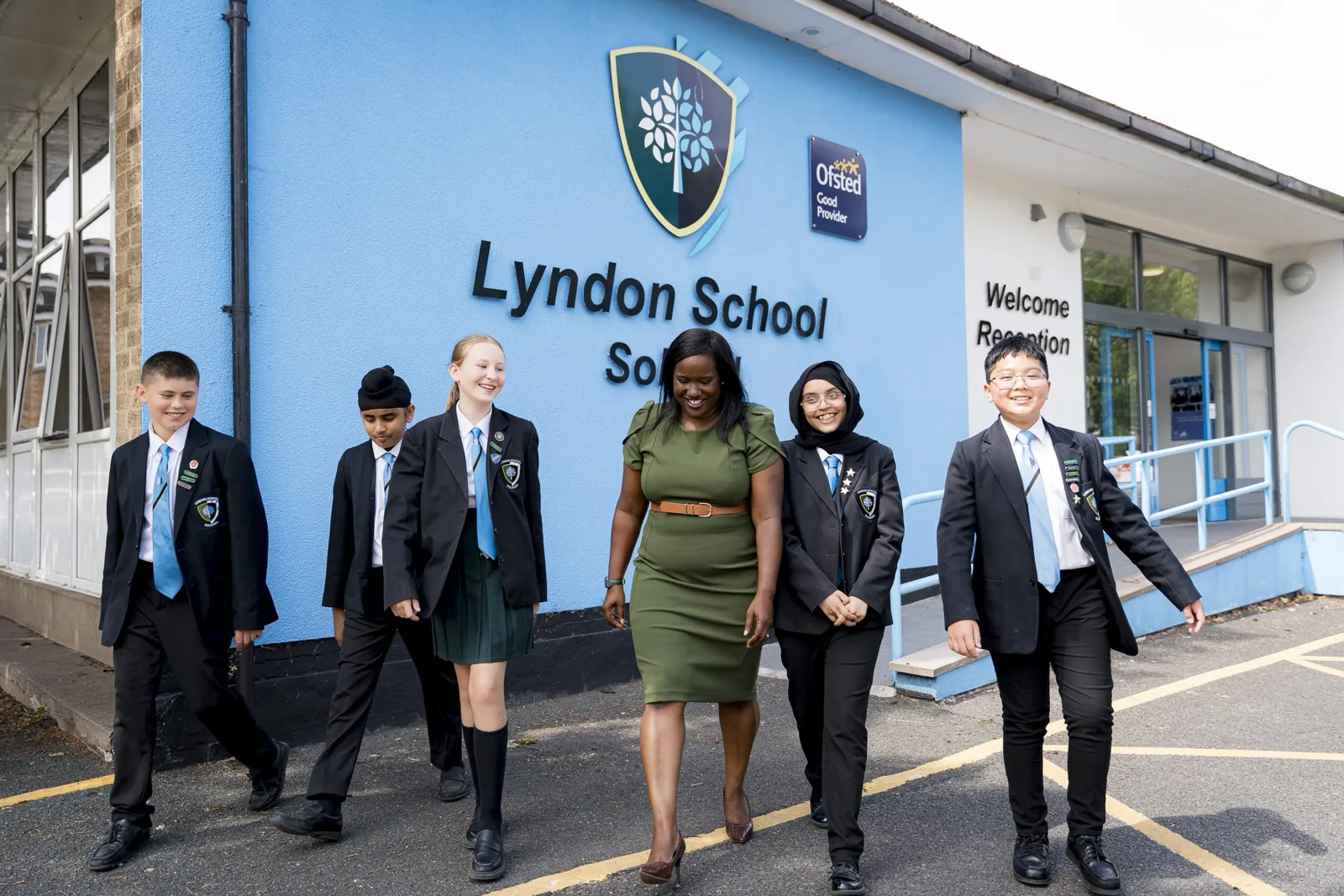 Pupils and staff outside Lyndon School on Daylesford Road