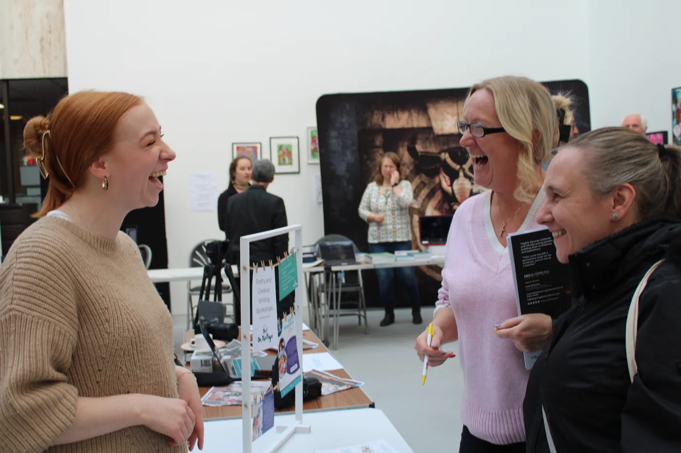 Visitors talking to an exhibitor at a stand at a previous Solihull CEP Tea Party