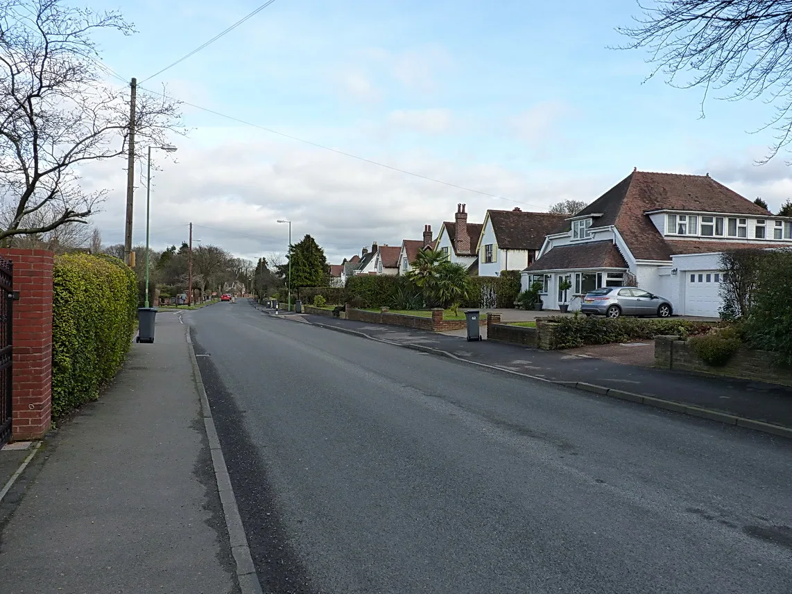 Dovehouse Lane at its junction with Ulverley Green Road, Olton. The picture does not show any of the three properties.